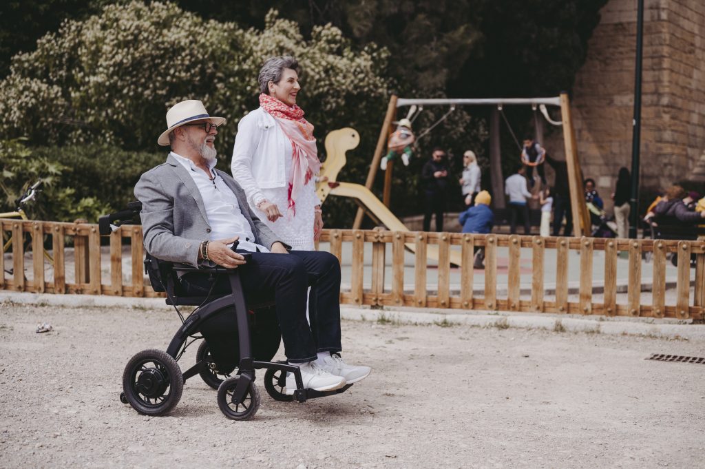People having a day out, one in a wheelchair